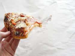 12749   Cold take out pizza slice
