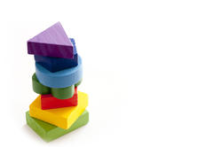 11962   Stack of Colorful Wooden Blocks in White Studio