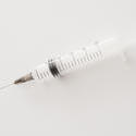 12950   syringe over white background