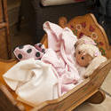 11965   Doll Nestled Under Blankets in Wooden Cradle