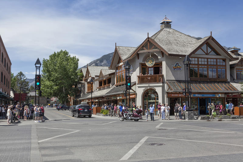 <p>Downtown Banff in the summer with shoppers and pedestrians out in town.</p>

