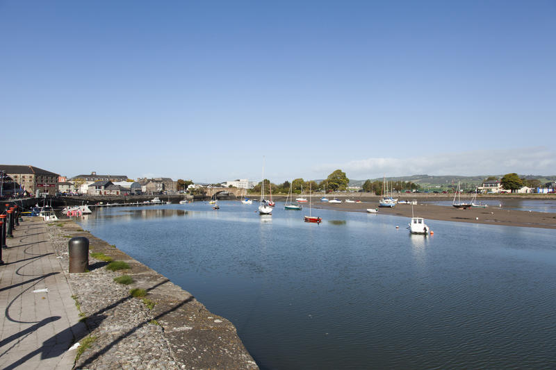 <p>Davitts Quay, Dungarvan, County Waterford, Ireland. This image shows boats moored at low tide.</p>
