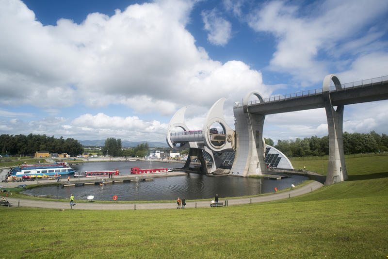 Picturesque view of the Falkirk Wheel, Scotland showing boats queuing to use the rotational boat lift connecting two canal systems