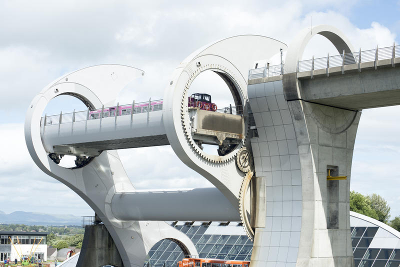The Falkirk Wheel rotational boat lift in Scotland with a barge on board connecting two canal transport systems