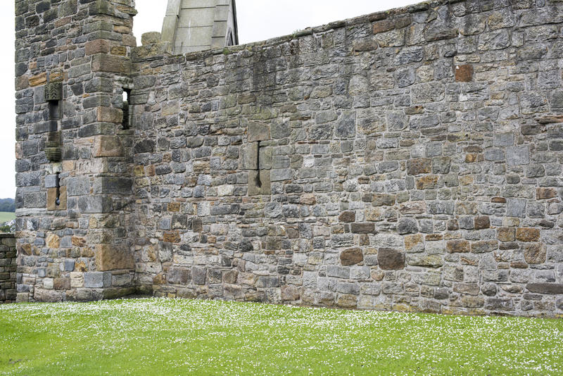 Fortified stone block wall at Saint Andrews Cathedral in Scotland, Europe. Includes copy space.