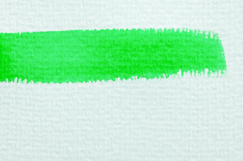 a background of linen texture paper with a green paint stroke