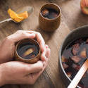 17170   Person warming their hands on mulled wine