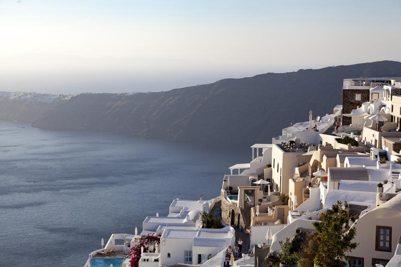 <p>The town of Imerovigli on the greek island of Santorini sits on the coast and is a popular tourist destination.</p>