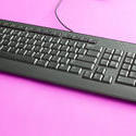 12712   Black computer keyboard on pink