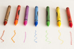 11952   Colorful Crayons Lined Up on Paper with Scribbles