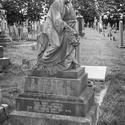 17040   Black and white gravestone in a graveyard