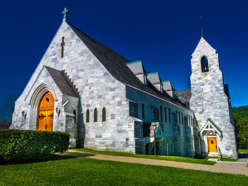 <p>North side of marble stone Catholic Church in rural Vermont early morning.</p>
