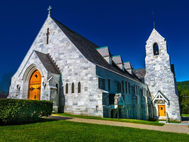 <p>North side of marble stone Catholic Church in rural Vermont early morning.</p>
