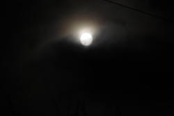 13062   moon reaching above the clouds