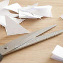 12182   Pair of Scissors on Wood Table with Scrap of Paper