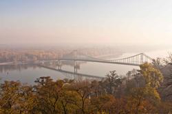 12049   pedestrian bridge on dnipro river in kiev in hazy autumn morning 1