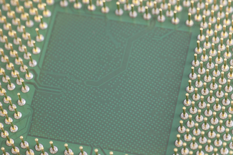Close-up pins of computer micro processor with empty square in the middle