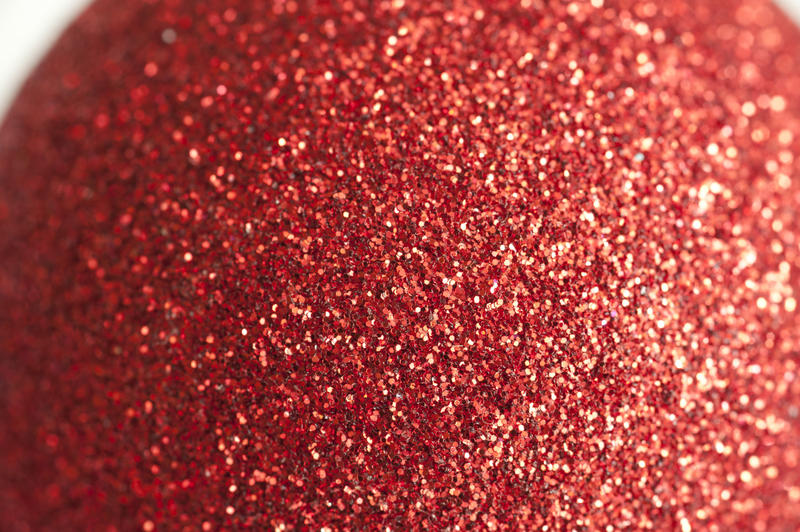 a close up image of a sparkly red glitter covered ball
