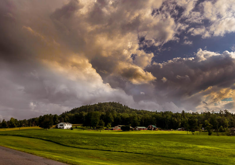 <p>Threatening storm clouds on the meadows in rural Vermont.</p>
