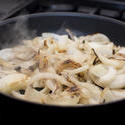 13028   sliced onions sauteing in a frying pan