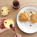 12342   spreading scones with butter and jam