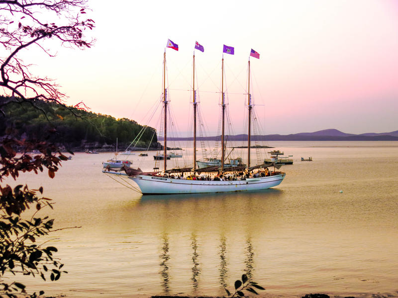 <p>An old scooner in Bar Harbor Maine pulling in with passengers and crew late afternoon.</p>
