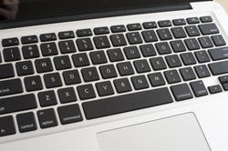 12738   High angle close up view of an open silver laptop