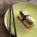 12370   tamagoyaki with fish on green plate