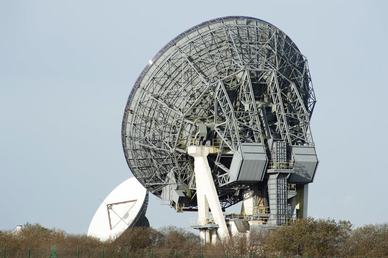 Satellite phone system ground station antennas, low angle view against clear sky