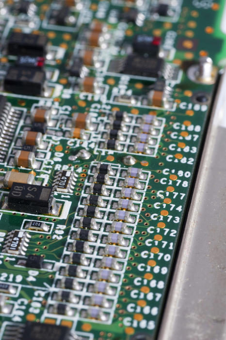 Close-up macro shot of termination resistors on green board