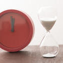 12961   Modern red timer clock with an egg timer