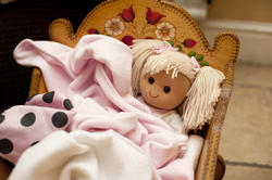 11955   Blond doll in a crib