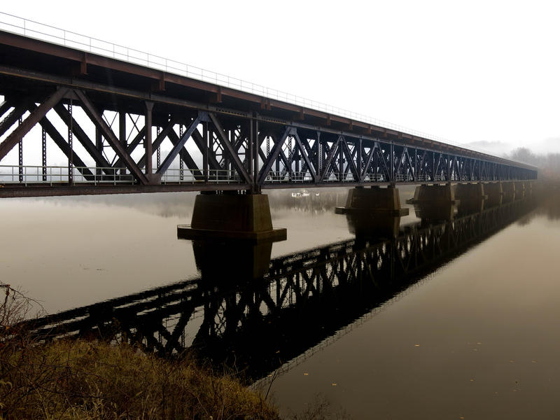 <p>Train tressel over the Hudson River on an overcast day.</p>