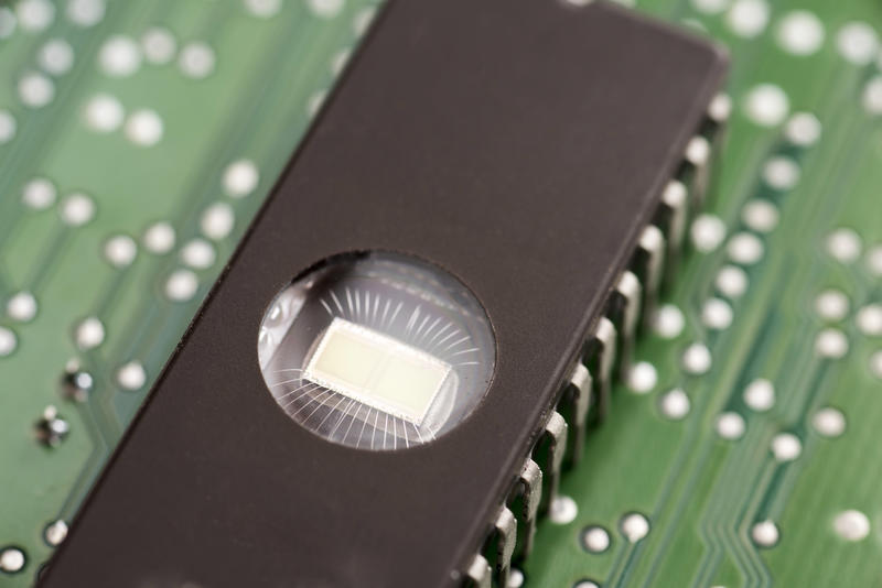 EEPROM integrated circuit memory chip on mother board, close-up macro shot