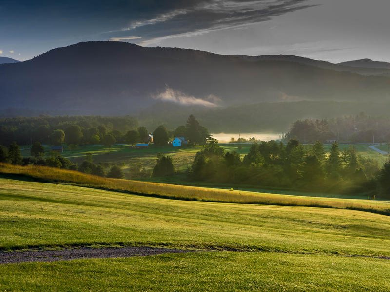 <p>Vermont morning valley and meadows with filtered light and fog.</p>
