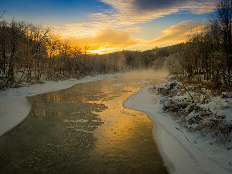 <p>Golden sunrize on the White River, in winter, in Bethel Vermont from the new bridge.</p>
