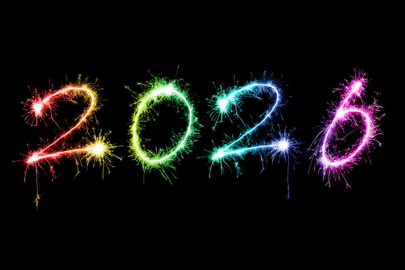 rainbow coloured sparkling fireworks as happy new year holiday 2026, isolated on black backdrop