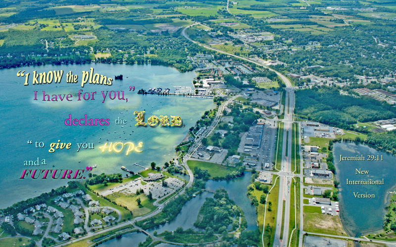<p>Airplane view: a highway runs across a lake near a marina with lots of boats</p>
Airplane view: a highway runs across a lake near a marina with lots of boats
