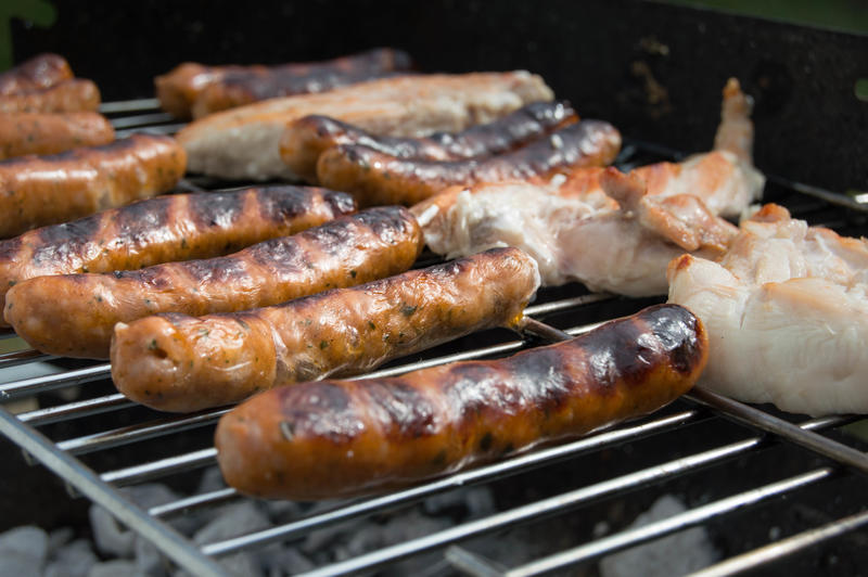 <p>Grilling sausages on a barbecue</p>
Grilling sausages on a barbecue