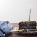 17296   Chocolate birthday cake with burning candle