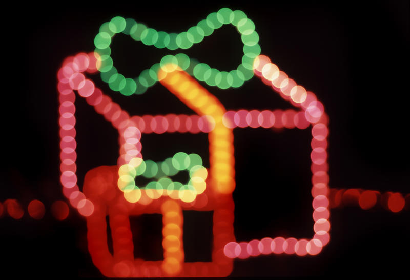 gift shaped outdoor christmas light pictured creating a string of colorful bokeh circles