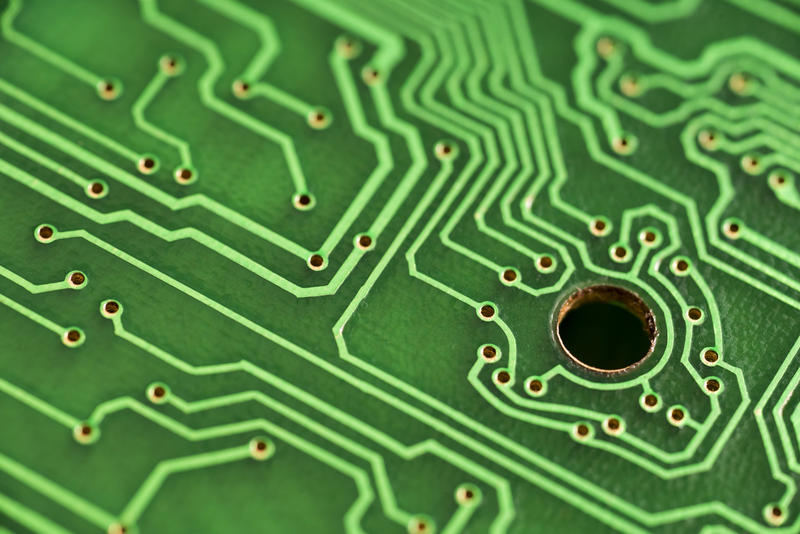 intricate tracks on a green coloured electronic circuit