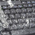 17863   Concept of IT waste with water soaking a keyboard