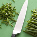 17236   Close up of sharp knife and chopped chives