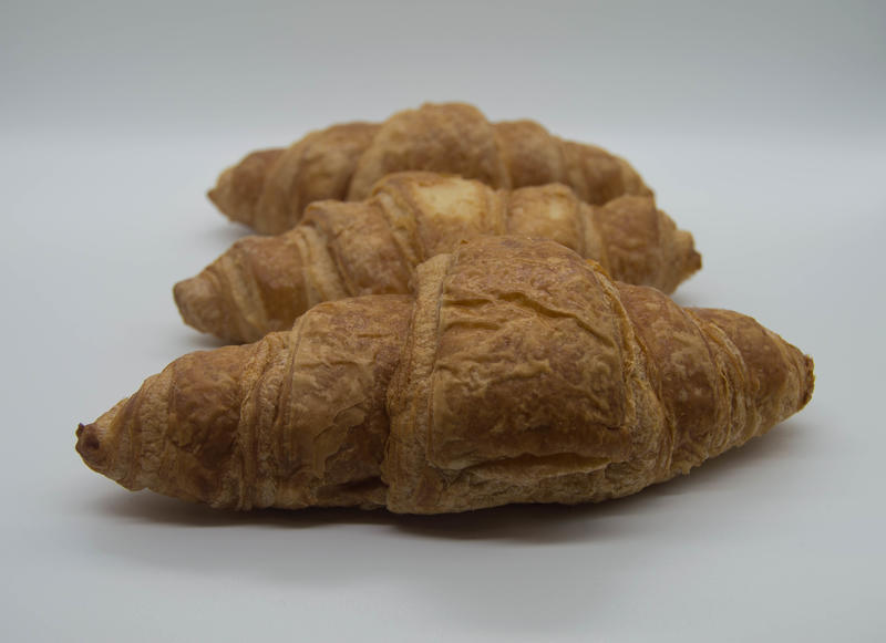 <p>Three croissants&nbsp;in a line with a white background</p>
Three croissants in a line