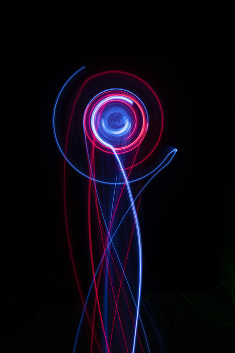 a ball of light with emerging motion trails in red and blue