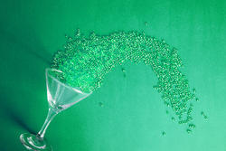 17300   Green martini cocktail party background concept