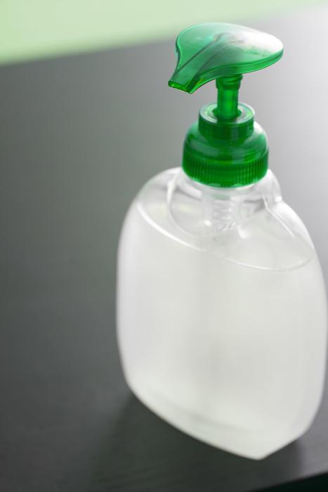 Close up on an unlabelled bottle of hand sanitizer with pump action in a concept of personal hygiene and and washing during the Covid-19 pandemic