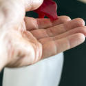 stock image 17410   Man using hand soap or sanitizer to wash