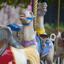 17808   Close up of horses on an empty carousel ride